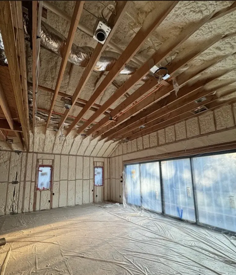 Interior walls and ceiling insulated with spray foam during new construction in Alexandria